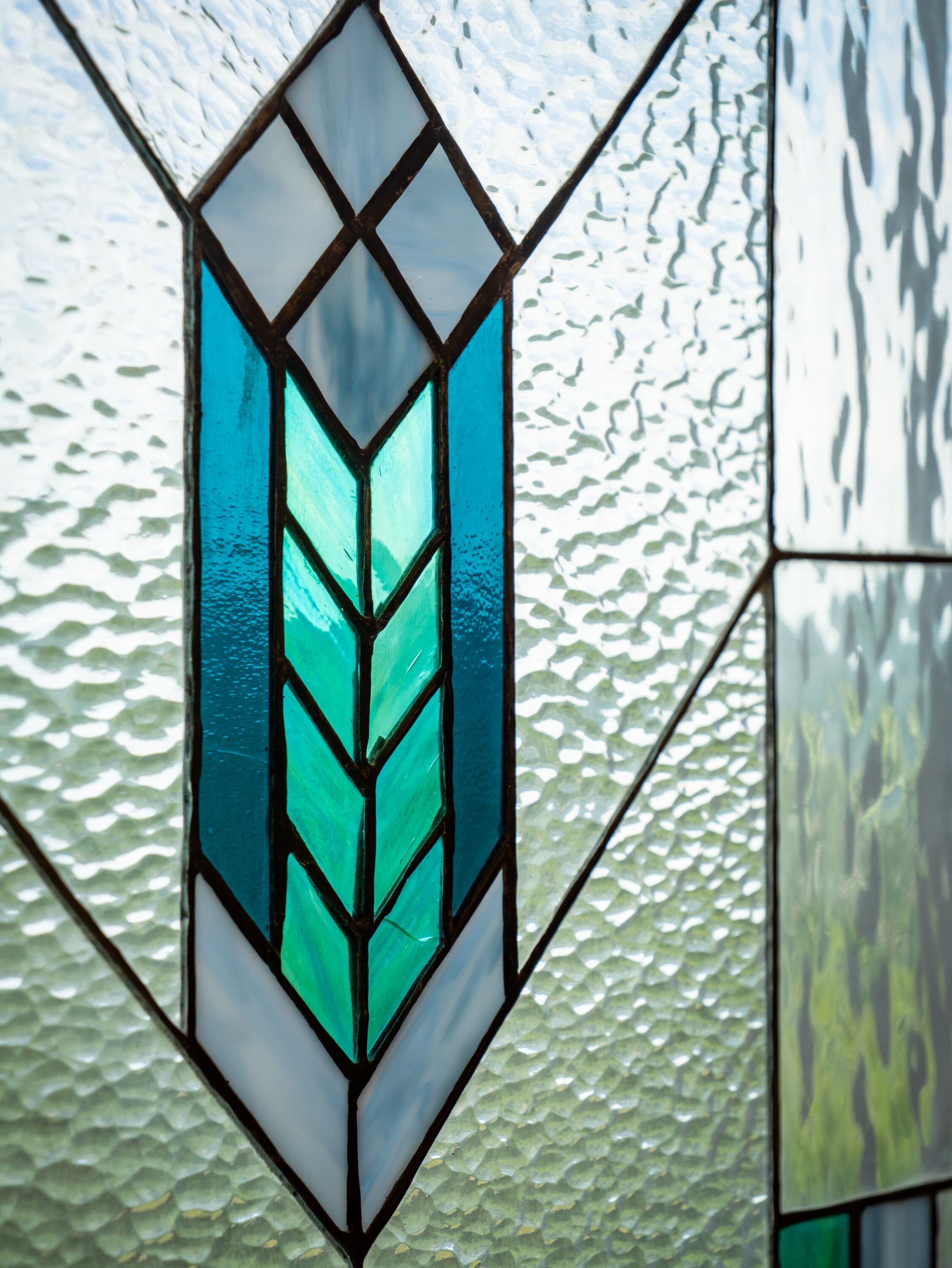 blue adn green stained glass in modern diagonal design