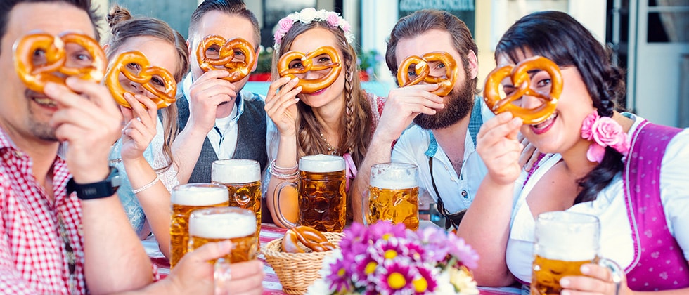 group of friends with pretzels at Hermann Oktoberfest