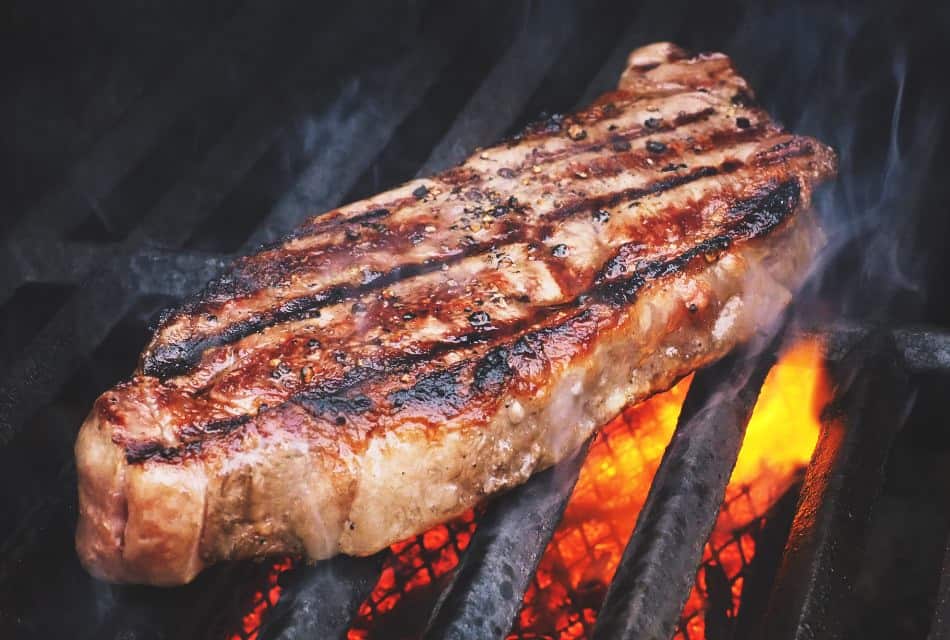 Close up view of steak on a grill