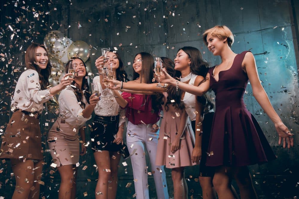 a group of girls drinking and having fun